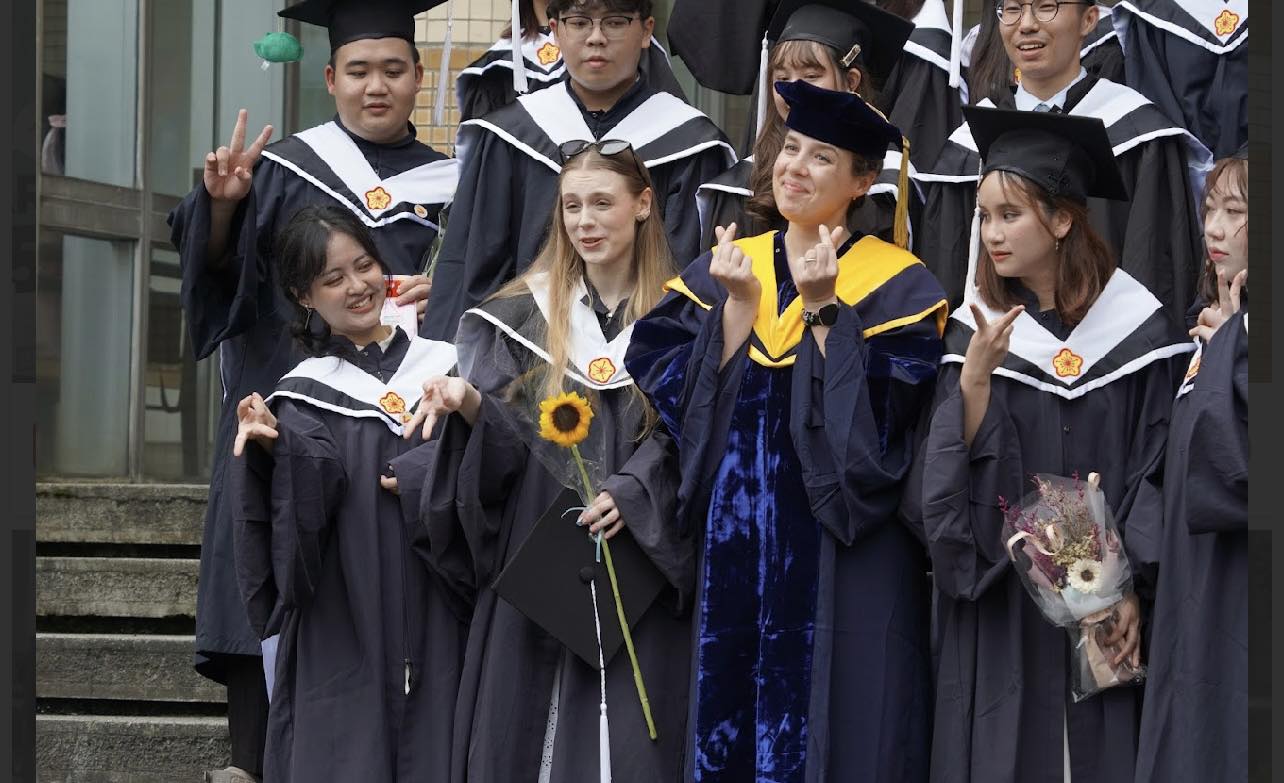 Graduates pose for joyful group photos to mark this meaningful moment.